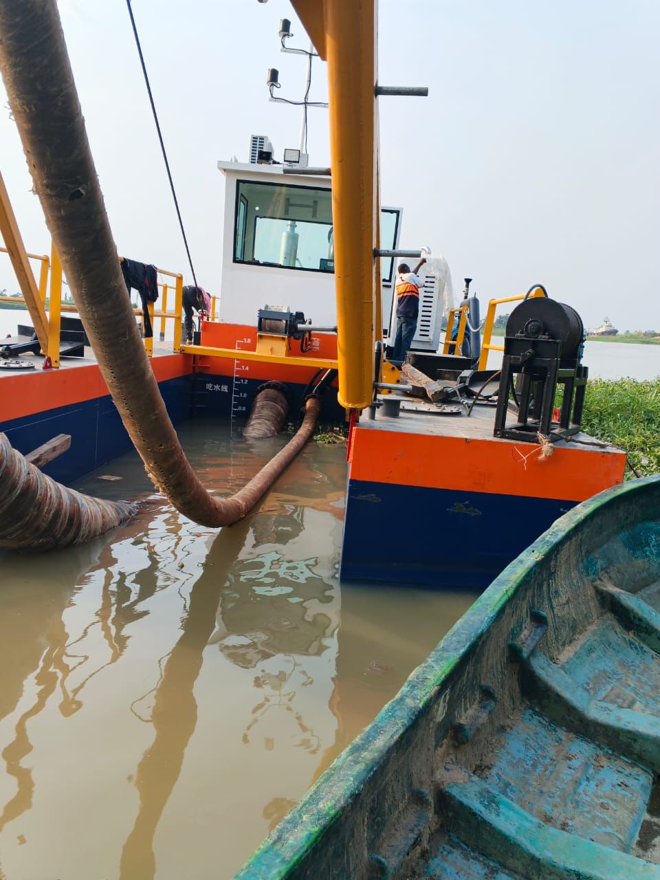 Dredger operating in waterway